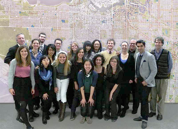 The authors standing in front of wall sized map of the city at 5,000 scale, showing enough housing and jobs for a city of 1.2 million. Back row left to right: instructor Patrick Condon, Niall MacRae, Peqi Wang, Rebecca Coulter, Jingling Sun, Patrick Chan, James Goodwyn, instructor Scot Hein, instructor James Tuer. Front row left to right: Lisa Lang, Margaret Soulstein, Jia Cheng, Cindy Hung, Neda Roohina, Paula Livingstone, Mary Wong, Nicci Theroux, Sara Orchard, Tate White, Sam Mohamad-Khany.